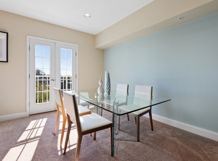 Furnished dining room with french doors at Market Street Flats apartments